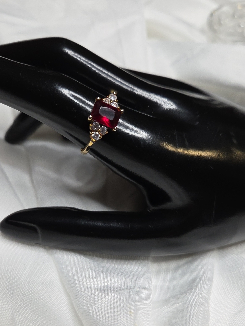 Gold Ring with Ruby-Red Cushion Gem and Clear Accents